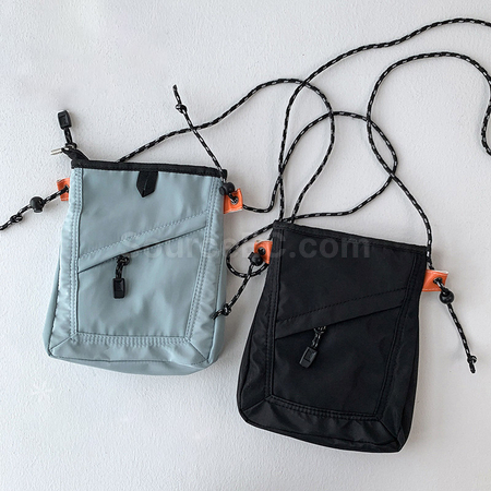 Inclined shoulder clearance bag